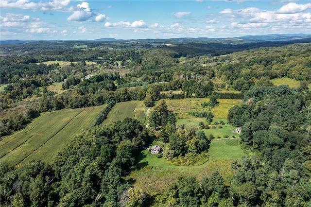 birds eye view of property featuring a view of trees