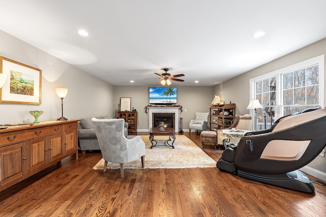 380 Hickory Rd, Southold, NY 11971 - living room featuring wood finished floors, recessed lighting, a fireplace, and baseboards