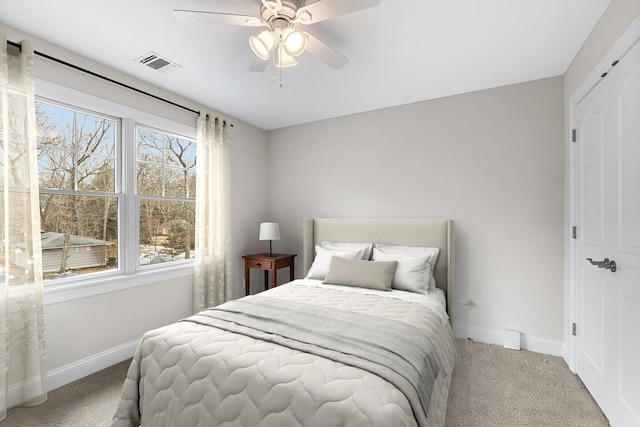 380 Hickory Rd, Southold, NY 11971 - carpeted bedroom with visible vents, baseboards, and a ceiling fan