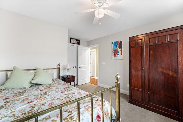 380 Hickory Rd, Southold, NY 11971 - bedroom with light carpet, ceiling fan, and baseboards