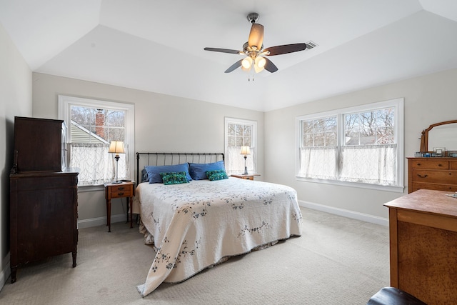 380 Hickory Rd, Southold, NY 11971 - bedroom with light colored carpet, a tray ceiling, baseboards, and vaulted ceiling