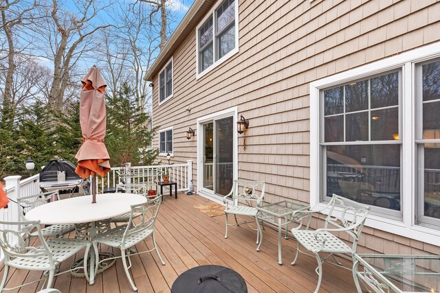 380 Hickory Rd, Southold, NY 11971 - wooden terrace with outdoor dining space