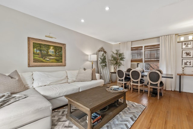 living area featuring recessed lighting and light wood-style floors