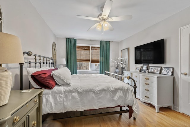 bedroom featuring a ceiling fan and light wood finished floors