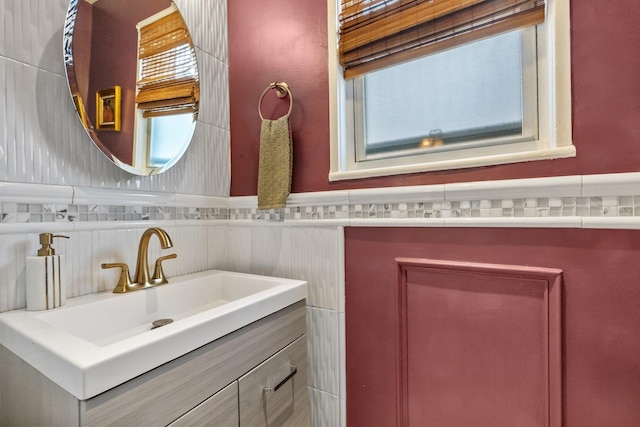 bathroom featuring vanity and a wainscoted wall