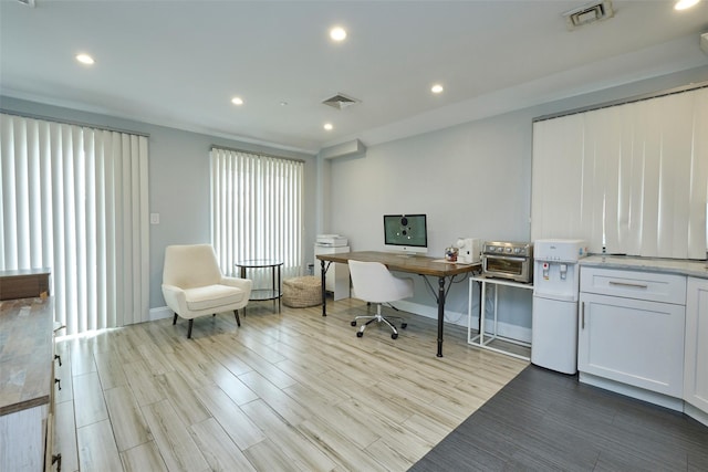 office featuring recessed lighting, visible vents, and wood finished floors