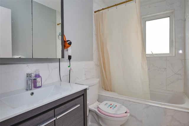 full bathroom with toilet, tile walls, shower / bath combination with curtain, and vanity