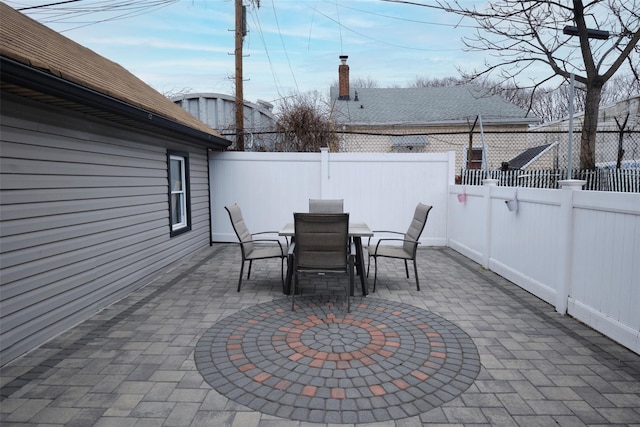 view of patio featuring a fenced backyard and outdoor dining space