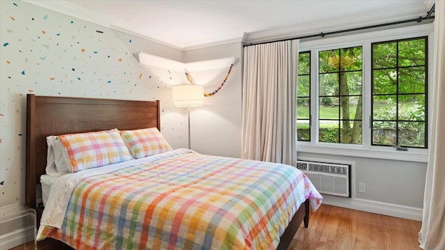 898 Gipsy Trail Rd, Carmel, NY 10512 - bedroom with ornamental molding, an AC wall unit, baseboards, and wood finished floors