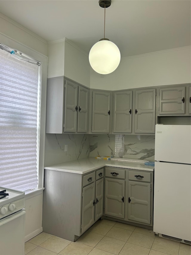 kitchen with white appliances, decorative backsplash, light countertops, and gray cabinetry