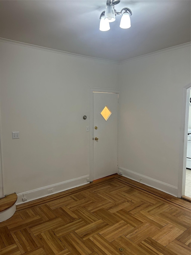 empty room with baseboards and ornamental molding