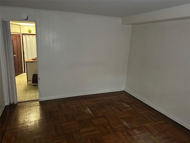 spare room featuring baseboards