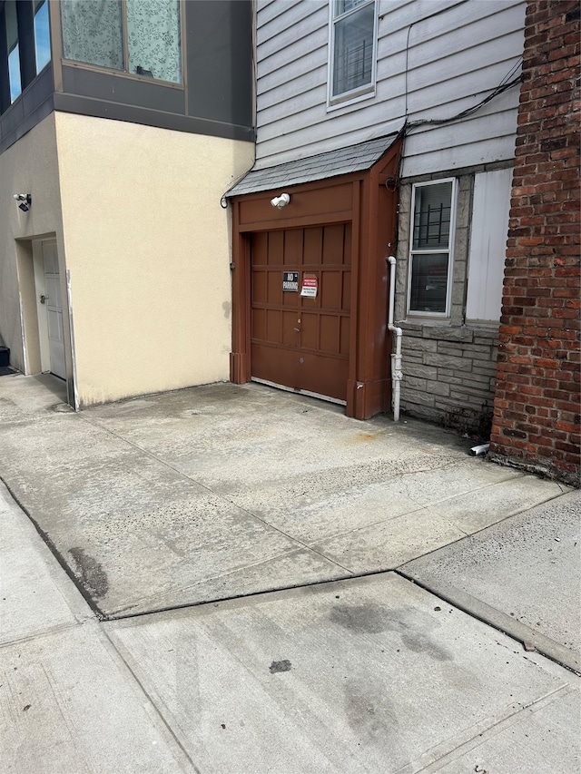 exterior space with concrete driveway