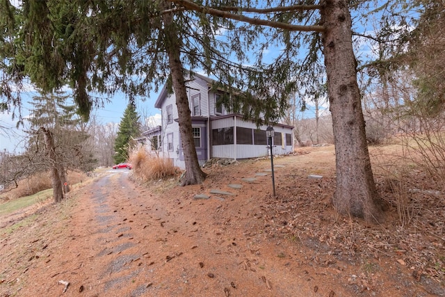 view of yard featuring a sunroom