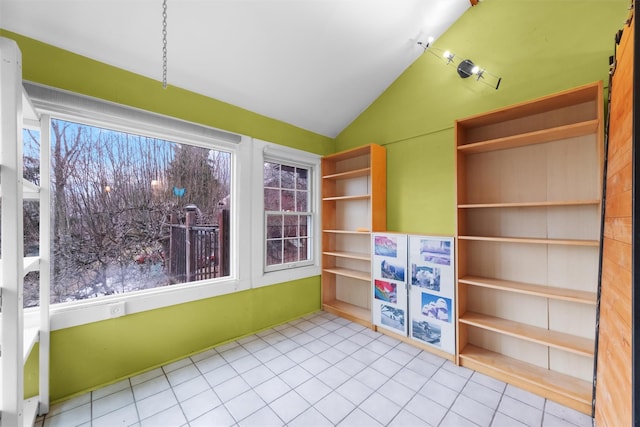 unfurnished sunroom with vaulted ceiling and a healthy amount of sunlight