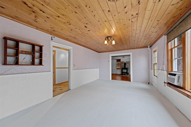 spare room featuring cooling unit, wooden ceiling, and ornamental molding