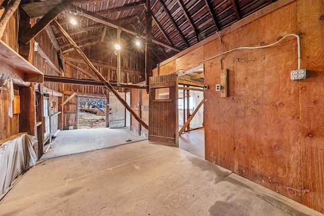 miscellaneous room featuring lofted ceiling