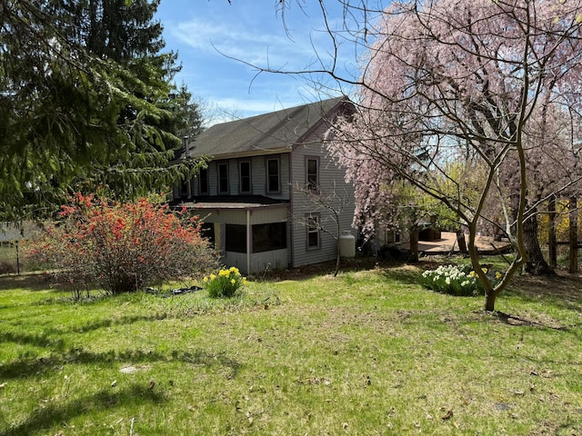 view of property exterior with a yard