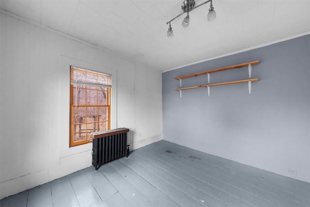 spare room featuring hardwood / wood-style floors