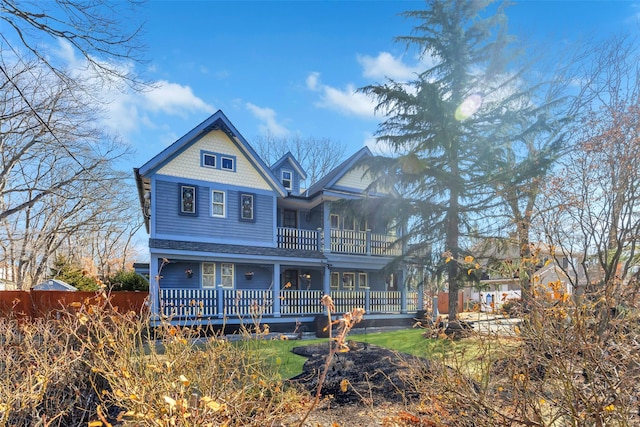 view of front of house featuring a balcony and covered porch