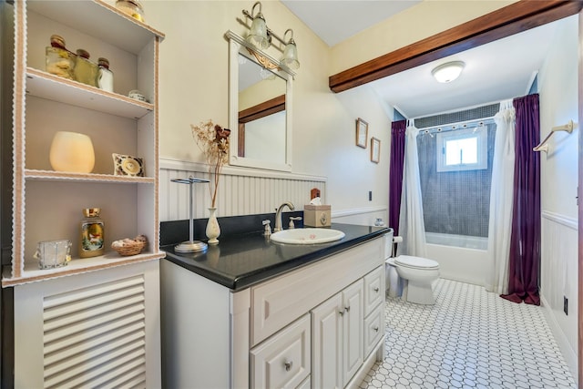 full bathroom featuring shower / tub combo, vanity, and toilet