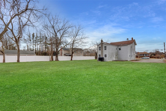 view of yard with fence