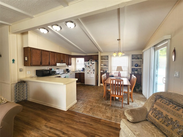 kitchen with lofted ceiling with beams, dark wood-type flooring, a peninsula, white appliances, and under cabinet range hood