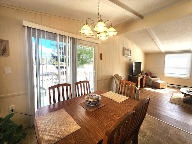 dining space featuring a baseboard radiator, a wall mounted air conditioner, plenty of natural light, and a textured ceiling