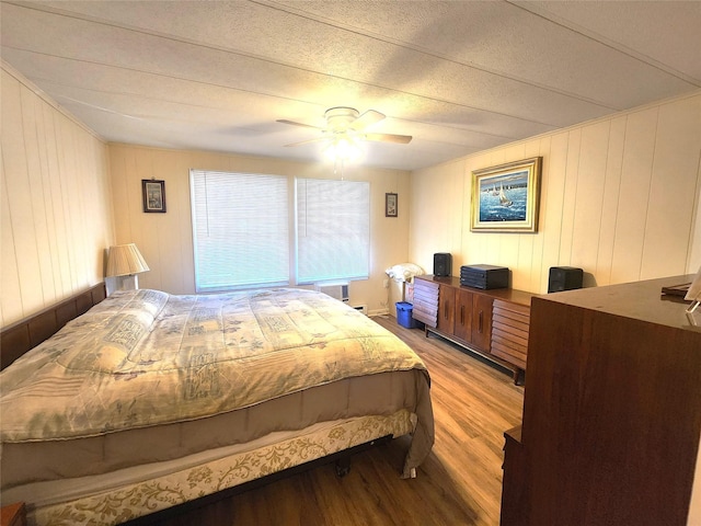 bedroom featuring a ceiling fan and wood finished floors