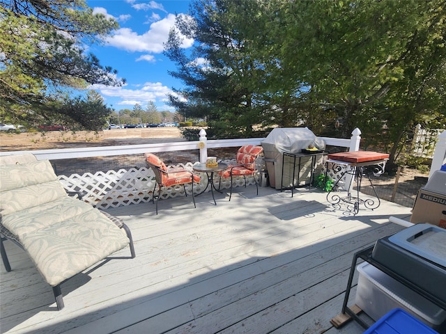 wooden terrace featuring area for grilling