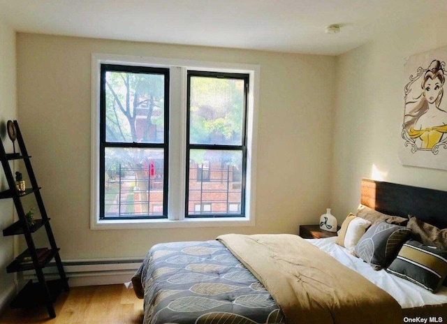 bedroom featuring wood finished floors