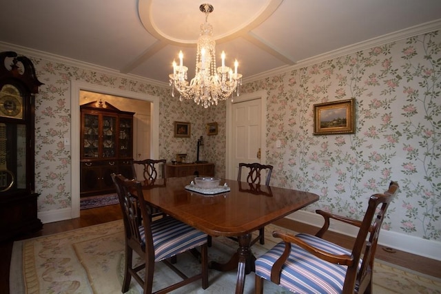 dining room featuring wallpapered walls, baseboards, a chandelier, and wood finished floors