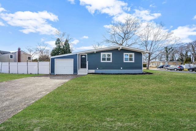 view of front of property featuring aphalt driveway, an attached garage, fence, and a front yard