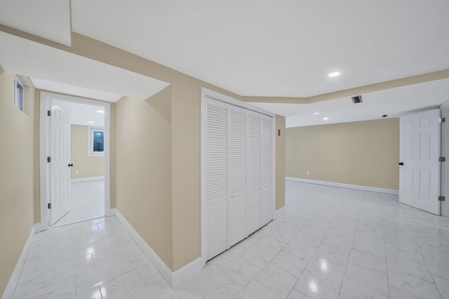 corridor featuring recessed lighting, visible vents, marble finish floor, and baseboards