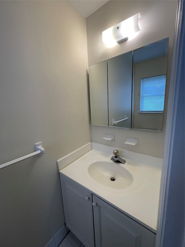 bathroom with vanity and tile patterned flooring