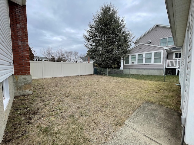 view of yard with a fenced backyard