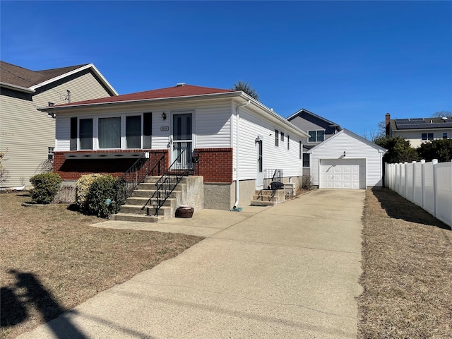 view of front facade featuring fence, concrete driveway, an outdoor structure, a garage, and brick siding