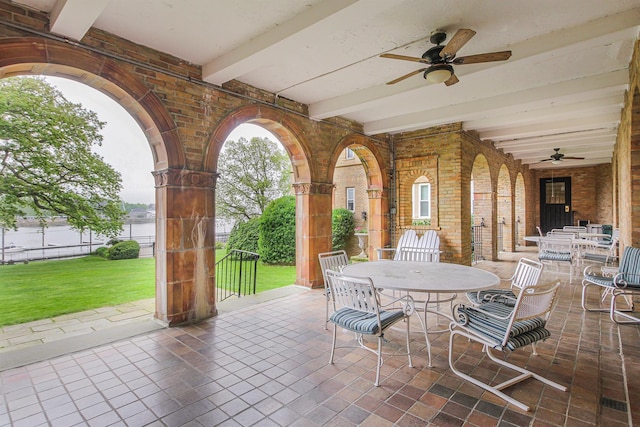 view of patio featuring ceiling fan and outdoor dining space