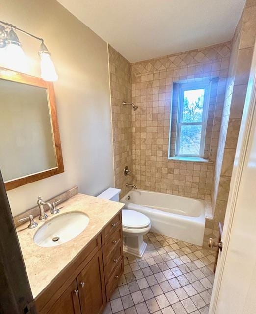 bathroom with toilet, tile patterned flooring, washtub / shower combination, and vanity