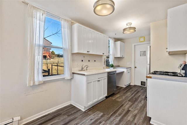 kitchen with dark wood-style floors, white cabinetry, a sink, dishwasher, and a baseboard heating unit