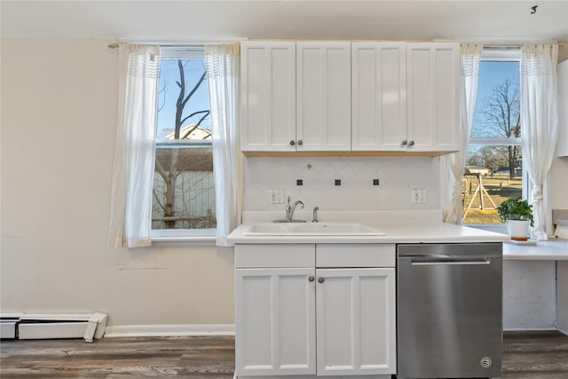 kitchen with a sink, a baseboard radiator, plenty of natural light, and dishwasher