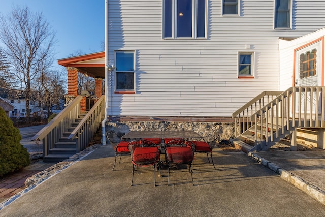 exterior space featuring stairway and a patio