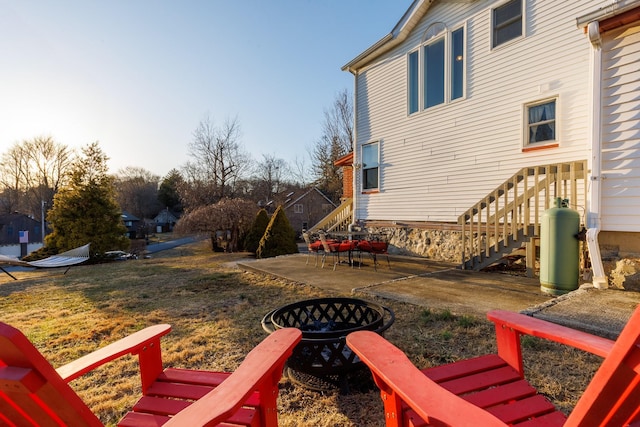 view of yard with stairs and a patio