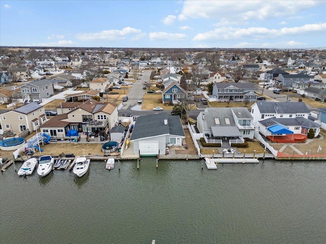 aerial view with a residential view and a water view