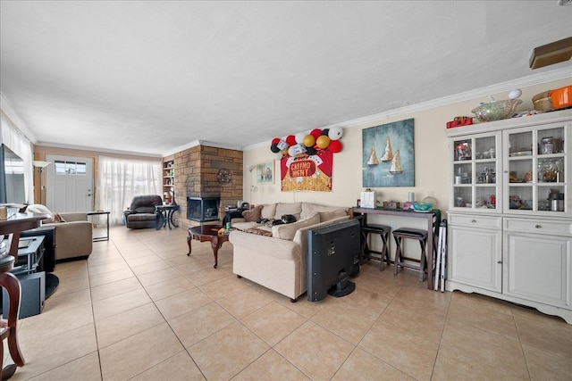 living room featuring light tile patterned flooring, crown molding, and a stone fireplace