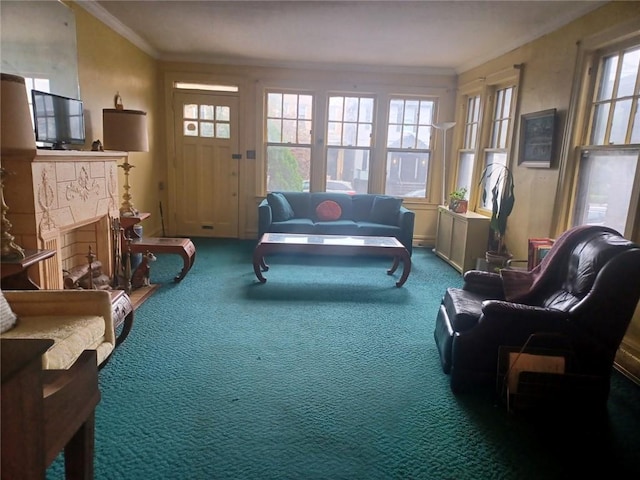 carpeted living room featuring a fireplace and crown molding