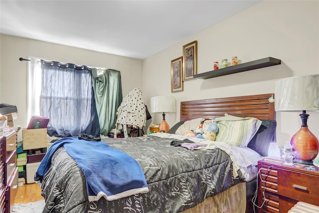 bedroom with wood finished floors