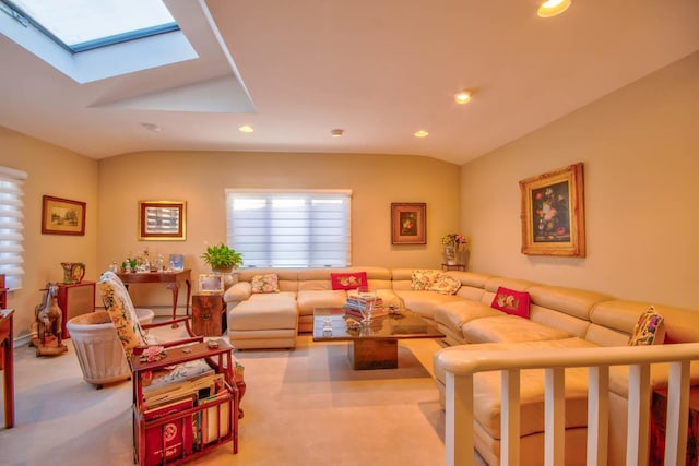 carpeted living area featuring recessed lighting and vaulted ceiling with skylight