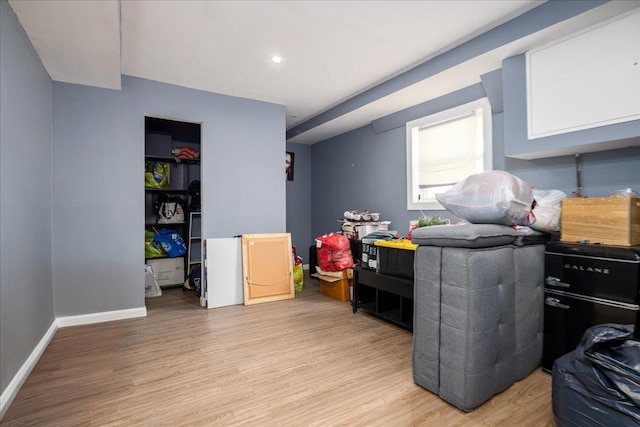 interior space featuring light wood-style floors and baseboards