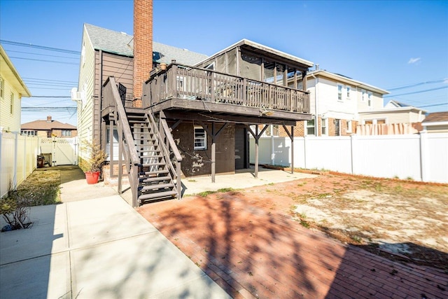 back of house with a patio, a fenced backyard, stairs, a gate, and a deck